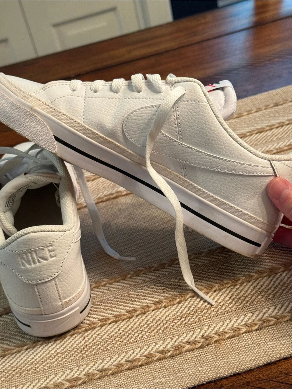 Nike White Low-Top Sneakers with Red Tongue Logo